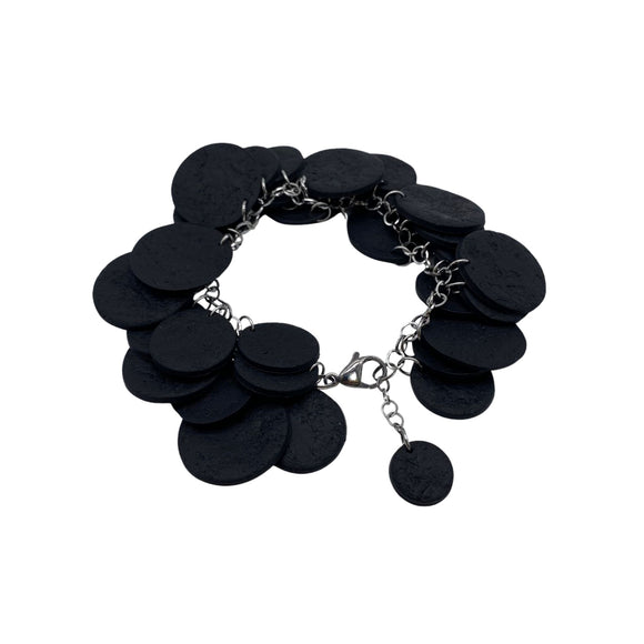 Black  polymer clay bracelet on a white background