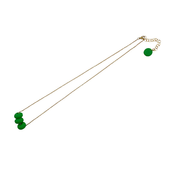 Bright Green polymer clay beads on a gold plated stainless steel chain on a white background