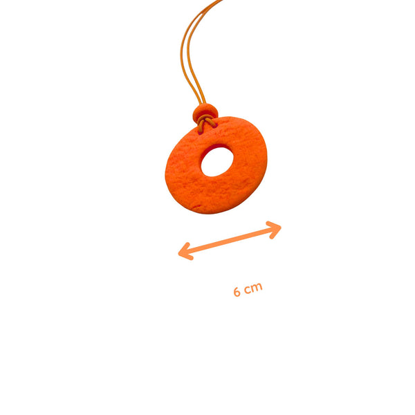 Orange Polymer clay necklace and showing size with on a white background