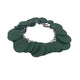 Dark green polymer clay bracelet on white background