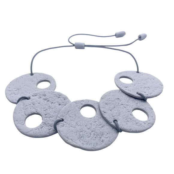 Grey polymer clay statement necklace on a white background 