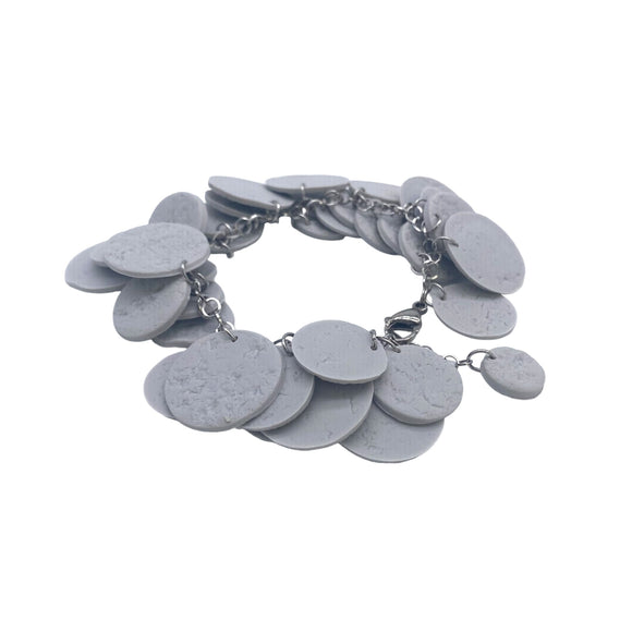 Grey polymer clay bracelet on white background