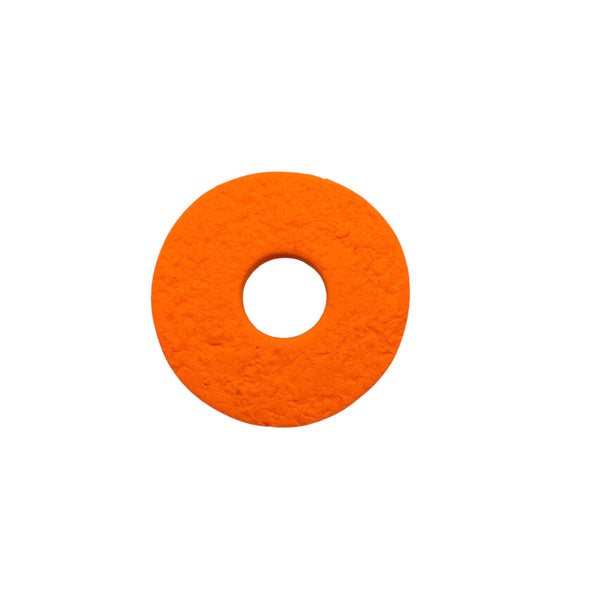 Orange polymer clay brooch on a white background