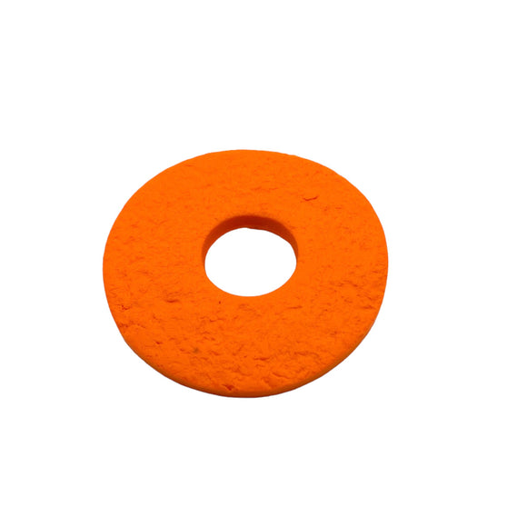 Orange polymer clay brooch on a white background