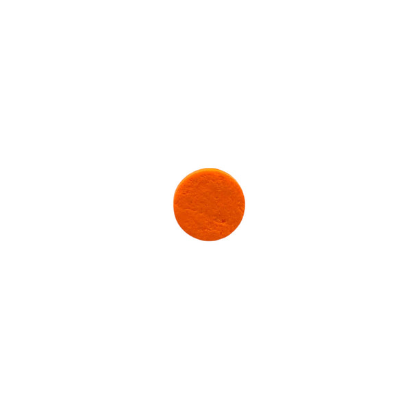 Orange small polymer clay ring on a white background