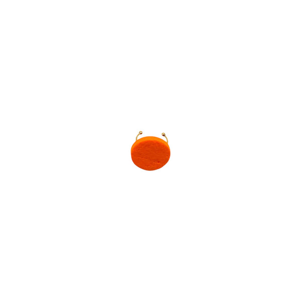 Orange small polymer clay ring on a white background