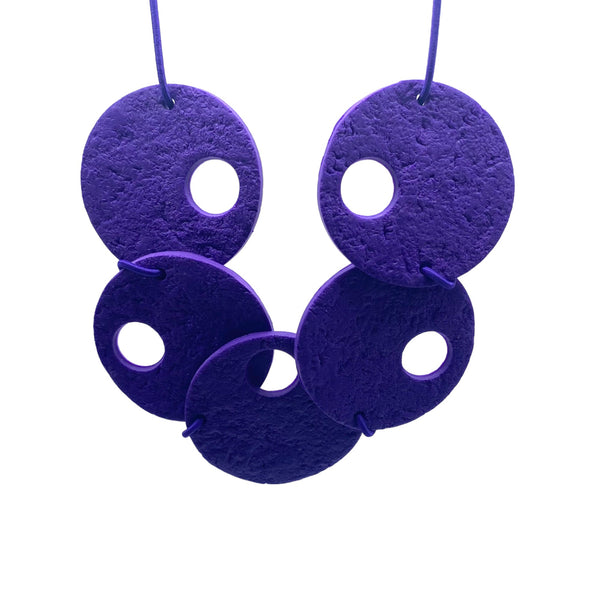 Purple polymer clay statement necklace on a white background 