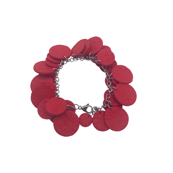 Red polymer clay bracelet on white background