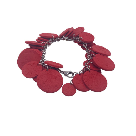 Red polymer clay bracelet on white background