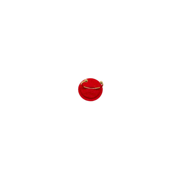 Red small polymer clay ring on a white background