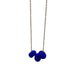 Royal Blue polymer clay beads on a gold plated stainless steel chain on a white background