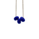 Royal Blue polymer clay beads on a gold plated stainless steel chain on a white background