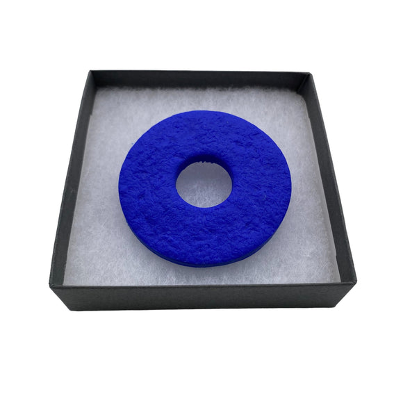 Royal Blue polymer clay brooch in a box on a white background