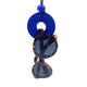 Royal Blue Small Circle Necklace with hole holding sunglasses  on a white background