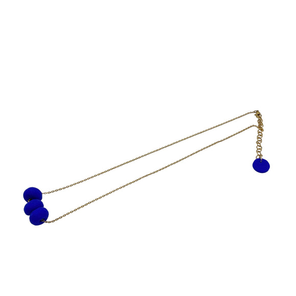 Royal Blue polymer clay beads on a gold plated stainless steel chain on a white background