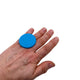 Someone wearing a Turquoise Large Polymer Clay Ring on a White Background