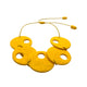 Yellow polymer clay statement necklace on a white background 