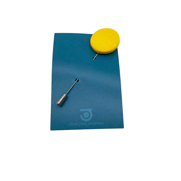 Yellow Polymer Clay Lapel Pin with stainless steel pin on a card on a white background