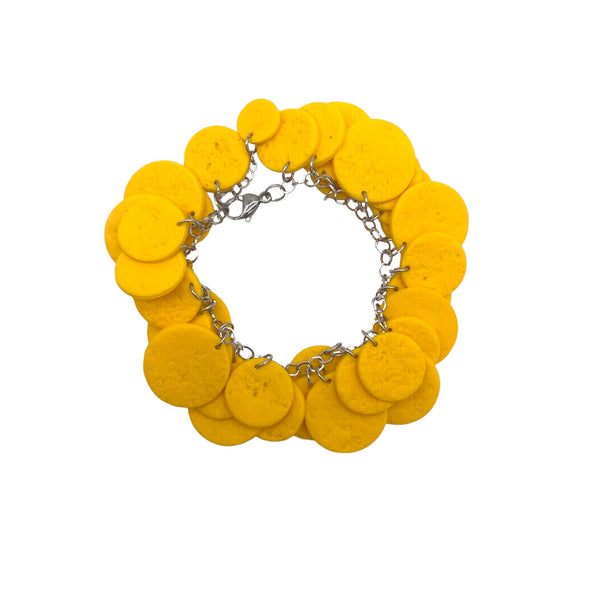 Yellow polymer clay bracelet on white background