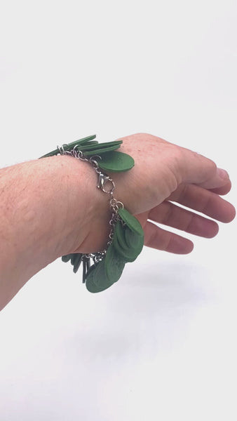 Video showing Dark green polymer clay bracelet on someone's wrist