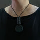 Someone wearing Black disc pendant statement Christie necklace