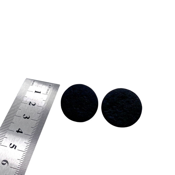 Black polymer clay round stud earrings showing diameter of earrings