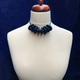 Navy Blue Disc and Bead Polymer Clay statement necklace with coordinating elastic cord on a mannequin to show the various lengths it can be worn