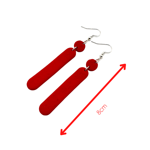 Red Polymer Clay Dangle earrings with shepherd hooks showing length of earrings