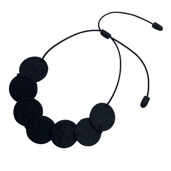 Black Polymer Clay necklace with overlapping discs at an angle